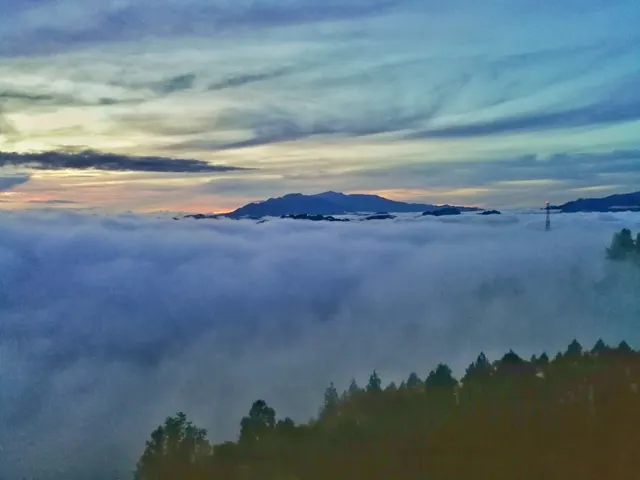 A sea of cloud filling the valley below Lolai at dawn